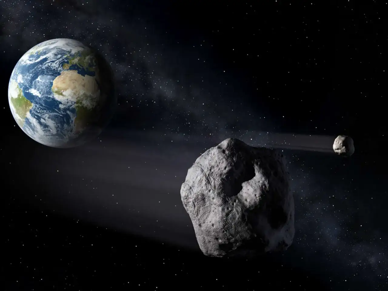 Ziemia i asteroida Apophis zbliżają się do siebie na tle gwiezdnego nieba.